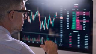 Crypto trader investor using computer analyzing cryptocurrency stock market.