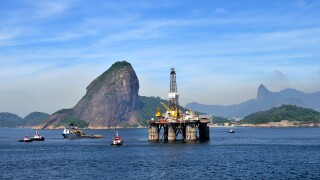 Oil rig of the Brazilian oil company Petrobras passing Sugarloaf Mountain, Bahia de Guanabara Bay, Rio de Janeiro, Brazil