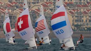 470 Women crew from Italy, Switzerland, USA and Netherlands, from left to right, compete during race 5 of the 470 Women class sailing competition of the 2008 Beijing Olympics in Qingdao, about 720 kilometers southeast of Beijing, Wednesday, Aug. 13, 2008.