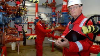 Technicians checking operations at Barry Power Station owned by Centrica.
