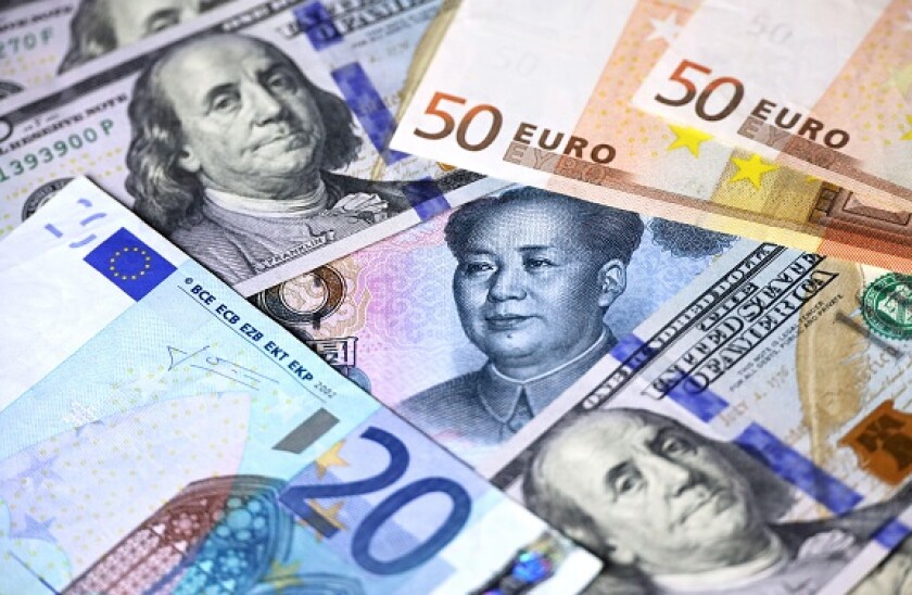 Chinese yuan surrounded with US dollars and Euro banknotes. Concept of trade war between the China and USA, exchange rate, global economy