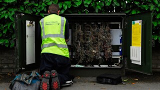 BT Openreach engineer checking telephone lines, Alton, Hampshire, UK.