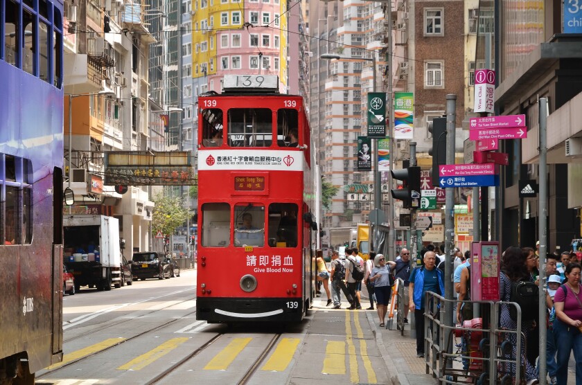 Hong Kong cityscape view with famous trams at Wan Chai district of Hong Kong