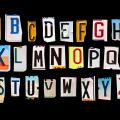 Alphabet set created with broken pieces of vintage car license plates