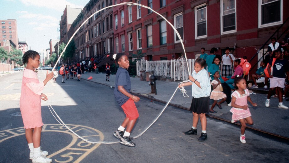 Young girls practice their double dutch skills on a Harlem play street. Image shot 1994. Exact date unknown.