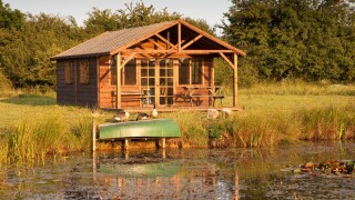 A summerhouse beside a lake, Wiltshire, England