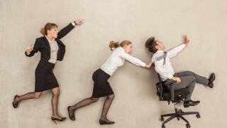 Business people chasing in office