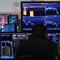 A trader works on the floor of the New York Stock Exchange, Tuesday, March 11, 2025. (AP Photo/Richard Drew)