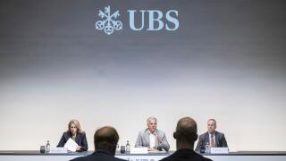 Group Chief Executive Officer of Swiss Bank UBS Sergio P. Ermotti, center, speaks next to Marsha Askins, left, and Todd Tuckner, right, during the presentation of the second quarter 2023 and first results since the Credit Suisse merger, in Zurich, Switzer