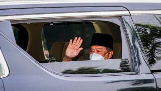 Kuala Lumpur, Malaysia. 04th Aug, 2021. Malaysia's Prime Minister Muhyiddin Yassin waves at the media as he arrives at the National Palace for an audience with King Al-Sultan Abdullah Ri'ayatuddin Al-Mustafa Billah Shah in Kuala Lumpur. United Malays Nati
