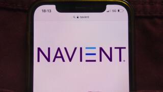 KONSKIE, POLAND - February 22, 2022: Navient Corporation logo displayed on mobile phone hidden in jeans pocket