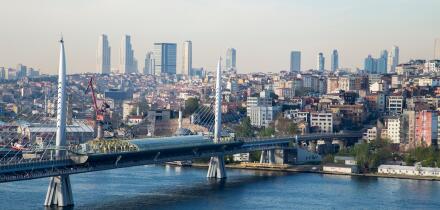 Golden Horn Metro Bridge with old and modern side of Istanbul background view during the day time. Lots of building and sea view