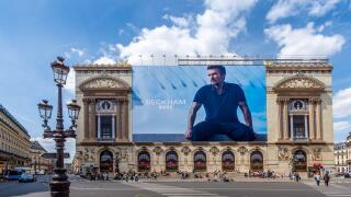 Advertising billboard for the Beckham - Boss clothing collection, by Hugo Boss, over the restoration works on the main facade of the Paris Opera house