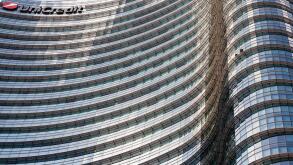 UniCredit Tower in the Porta Nuova District, Milan, Lombardy, Italy. Exterior view of curved glass facade of the tallest building in Italy.