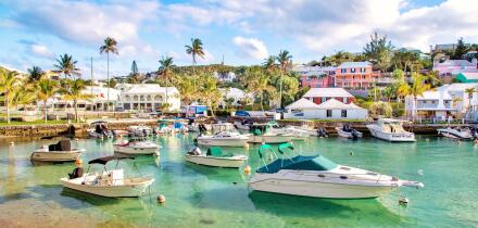 Boats moored in the clear turquoise waters of Flatt's Inlet, Hamilton Parish, Bermuda, Atlantic, Central America