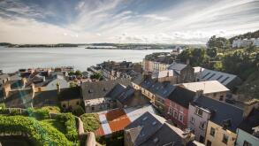 Terraced streets of colourful houses in the small tourist city of Cobh on the shores of Cork Harbour on the south coast of Ireland.
