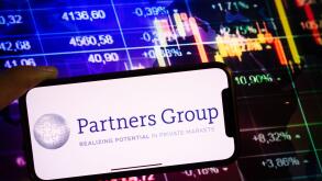 KONSKIE, POLAND - September 10, 2022: Smartphone displaying logo of Partners Group company on stock exchange diagram background