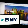 Stuttgart, Germany - 01-30-2025: Person holding smartphone with logo of company The Bank of New York Mellon Corporation (BNY) on screen