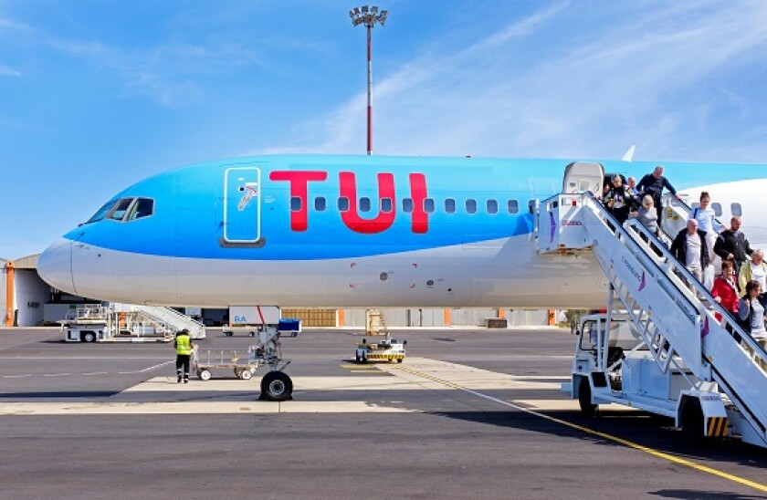 British Tourists disembarking from a TUI Boeing 757 200 jet at Amicar Cabral International Airport, Cape Verde, Africa