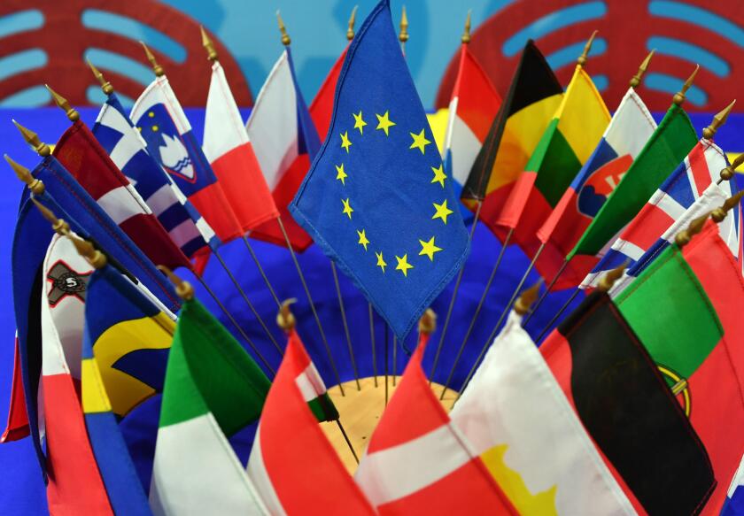 The flags of the EU member states are displayed with the EU flag on a table at the European Information Center in Erfurt, Germany, 08 February 2017. Photo: Jens Kalaene/dpa-Zentralbild/ZB