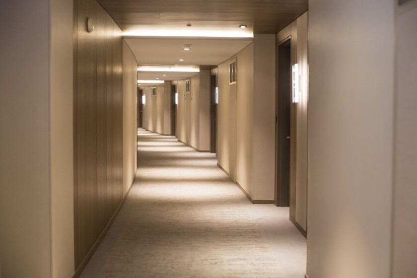 Empty hotel corridor from Adobe 9Jul20 575x375