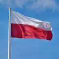 Polish flag against blue sky