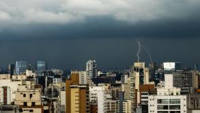 City Skyline of an afternoon lightning storm with multiple lightning bolts over the Vila Olimpia and Chacara Itaim neighboor in Sao Paulo, Brazil