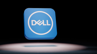 A digital render of Intel's logo in a 3D graphic floating in the air above a grey floor set against a black background