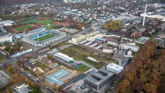 Aerial view, VONOVIA Ruhrstadion, renaming, riot police between Gersteinring and Castroper street at the JVA Krumede, Bochum,