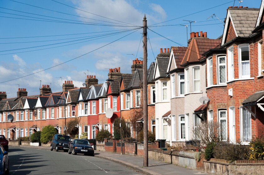 Row of terraced houses in residential Street, London, England, UK