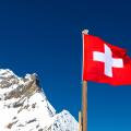 Swiss flag at the top of Jungfraujoch Plateau, Jungfrau Peak, Switzerland