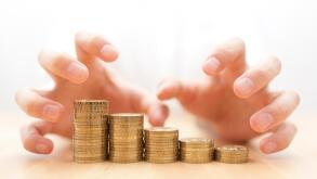 Greed for money. Hands grabbing coins.