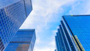 Los Angeles, California - January 7, 2025: Dynamic view of TCW Tower, City National Bank, and SMBC Manubank set against a bright blue sky, highlightin