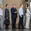 Businesspeople waiting in queue for elevator