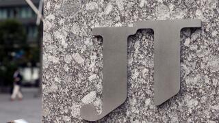 A picture taken on Oct.10, 2018 shows a Company Logo of Japan Tobacco Inc. in front of its Head office in Minato, Tokyo.( The Yomiuri Shimbun via AP Images )